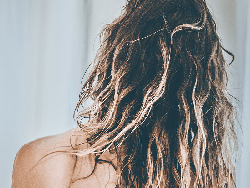 Woman with wet damaged hair
