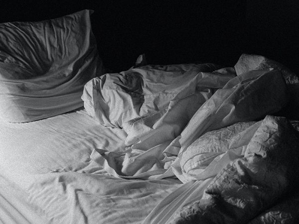 Black and white unmade bed